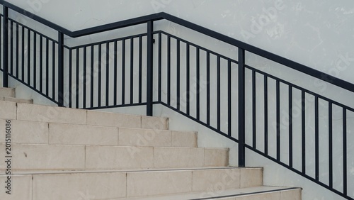 Obraz na plátně Modern staircase with black metal railing minimalist interior design