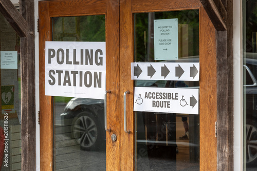 Sutton Scotney Hampshire England UK.08.05.2026. Wooden double doors of a polling station are adorned with signs for 'Polling Station',