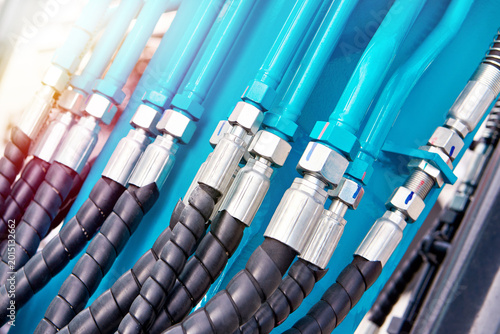 Hydraulic hoses and connectors on industrial machinery