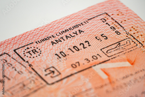 Immigration entry stamp in passport for Antalya, Turkey. International travel, border control, tourism and summer vacation destination