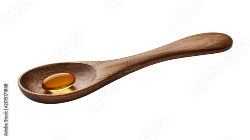 A wooden spoon holds a small amount of honey on a plain background