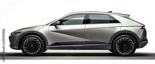 Sleek silver compact crossover side profile with geometric two-tone panels, large intricate alloy wheels and a futuristic, confident studio presentation
