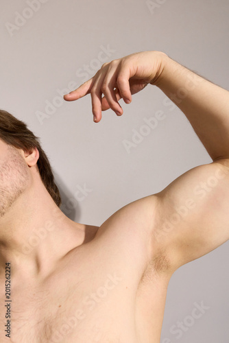 A man shows off his muscles, a real photo of people
