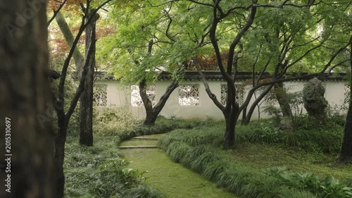 Quiet pathway in a classical Chinese garden in Suzhou
