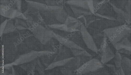 Konstfotografi Dark crumpled paper texture fills the frame with sharp creases and shadows
