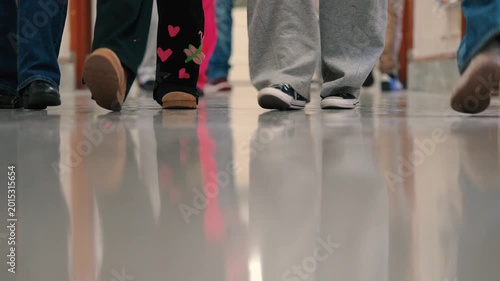 Students Walking in School Hallway