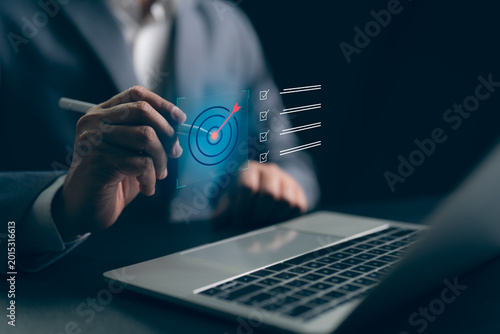 Fotografi Businessman select target goals strategic for business purpose, goal achievement and futuristic innovation for strategic planning