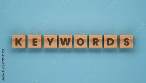 Quadro su tela Keywords blocks on a Blue Surface: Wooden blocks spell out KEYWORDS set against a tranquil backdrop, emphasizing the essential elements of effective search engine optimization