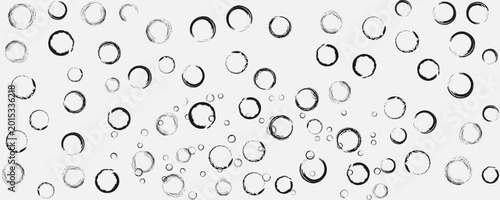 A delightful pattern of numerous small and large clear bubbles floating on a white background creating a beautiful and airy visual effect