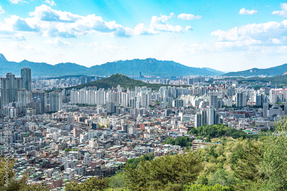 Fototapeta premium Seoul, South Korea - Mar. 08, 2026 : Panoramic cityscape of Seoul with dense residential buildings and Han River from Yongmasan observatory