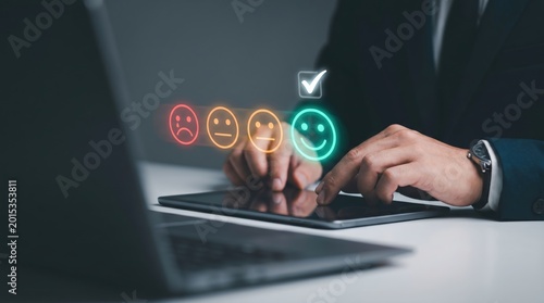 Customer Satisfaction Feedback: Business Professional Selecting Happy Emoji Hologram on Tablet in Modern Office