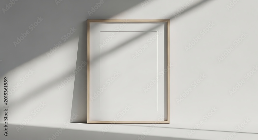Fototapeta premium Golden picture frame on white wall with sunlight
