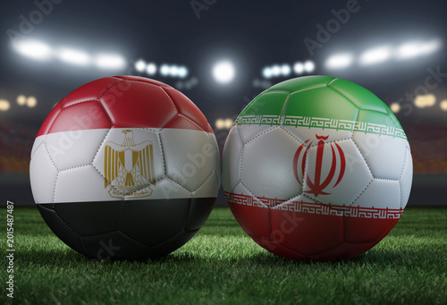 Two soccer balls in flags colors on a stadium blurred background. Egypt vs Iran. 3D image.
