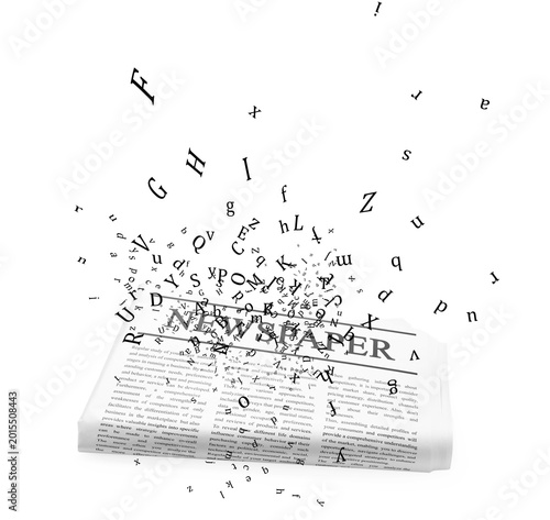 Letters flying above newspaper on white background