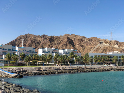 Houses on the beach near mountain