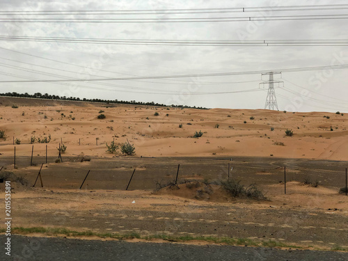 driving along the highway through the Arabian desert