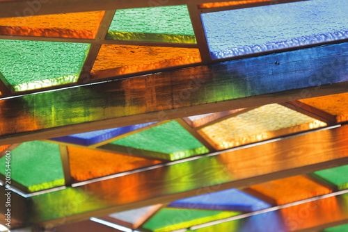 Konstfotografi A detailed view of a stained glass bench with intricate designs and colors