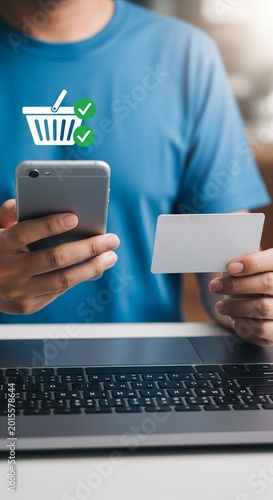 Person holding smartphone and credit card for online shopping with shopping cart icon
