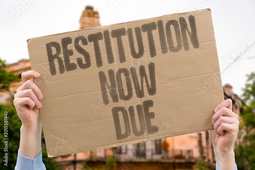 Photos "Restitution Now Due" Colonized nations legally pursue restitution for historical losses