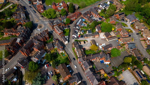 Aerial top down view of historic village streets and brick houses