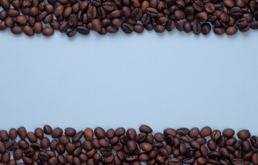 Blue background with roasted coffee beans on the side, copy space, frame coffee background, coffee menu design