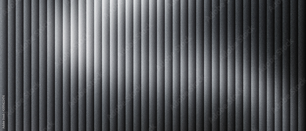 Obraz premium Industrial corrugated metal texture with vertical ridges, dark gray brushed steel surface with soft light reflections, metallic ribbed wall paneling, modern architectural aluminum backdrop.