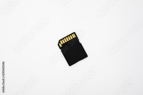 Fotografie Small black SD card on plain white surface