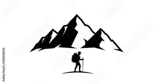 Silhouette of a lone hiker with a backpack and trekking pole standing before majestic mountains.