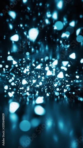 Abstract motion background with sparkling blue light particles creating a dynamic and ethereal atmosphere.