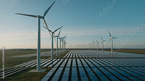 Φωτογραφία Wind turbines and solar panels in a field on a sunny day with blue sky and cloud