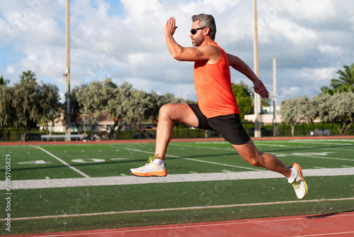 Sportsman jogger running. Man sportsman running for exercise. Sport athlete man run. Cardio workout. Runner at long sport run. Sportsman runner running outdoor. Sport run. Muscular man running
