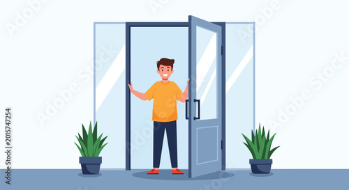 Friendly young man standing in the open doorway of a modern building welcoming visitors with a warm and happy inviting smile.