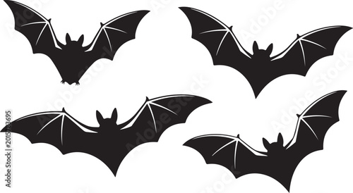 Bild auf Leinwand Four black bats flying in formation