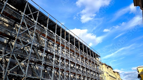 Canvas Print Moscow, Russia - April 23, 2026: Metal scaffolding on the facade of a building