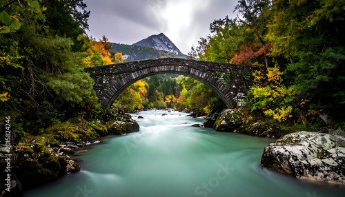 stone bridge over turquoise river landscape.