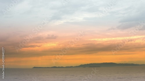 Orange Sunset Over the Evening Sea with Island Silhouettes