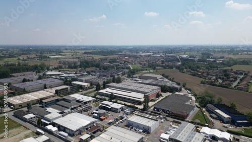 Photos Industrial Landscape under the Sky: A sweeping aerial view presents an expansive industrial area, comprising a diverse array of factory buildings, warehouses, and logistical hubs