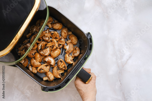 Cooking mushrooms in an air fryer for a tasty meal at home in the kitchen