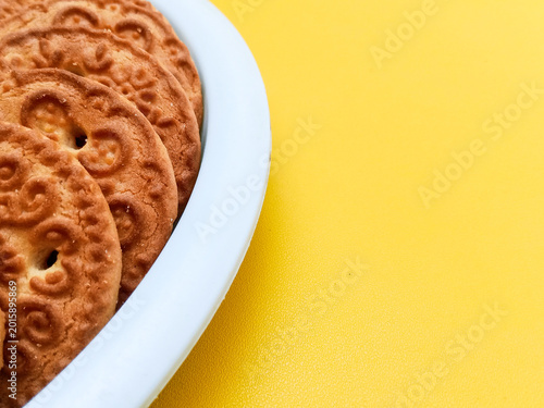 Healthy Wheat Biscuits on White Plate Top View for Snack Concept
