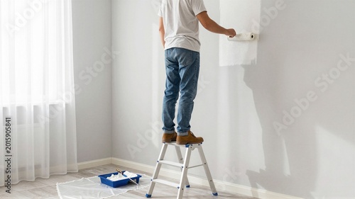 Craftsman Painting Bedroom Walls with Roller