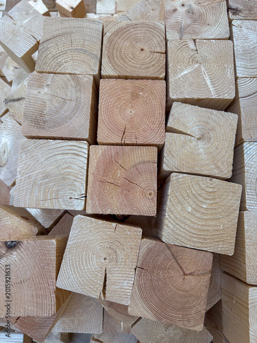 Фотография Square pine wood blocks for flooring or construction, natural timber cubes for i
