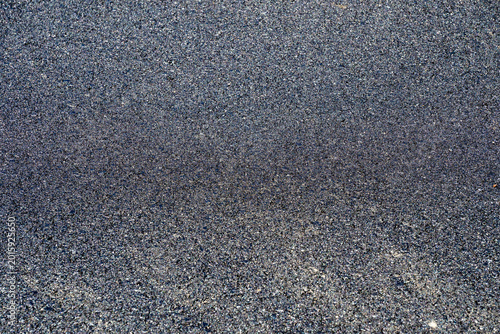 Φωτογραφία the uniform, grainy texture of a freshly laid asphalt surface.