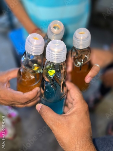 Colorful marble-sealed Goli Soda glass bottles in Pune, India