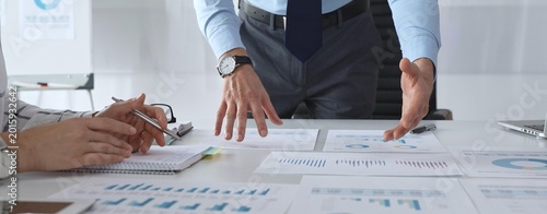 Canvas Print Business team analyzing financial charts and graphs during strategy meeting in m