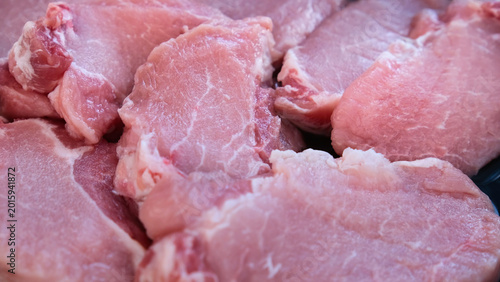 Schilderij op canvas Raw Meat Texture Background with Fresh Pork Slices Close-Up