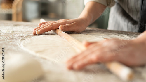 Photos Kneading dough at the kitchen table