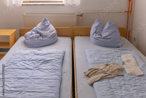 Φωτογραφία Cozy guest room with neatly made beds and soft pillows awaiting a restful night