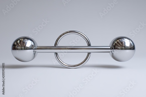 Silver metal barbell with rounded ends and connecting circle