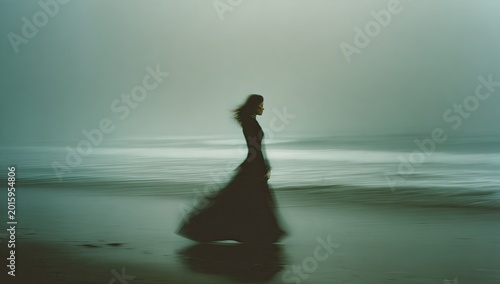 Ethereal figure in flowing dark gown walks along misty, blurred shoreline