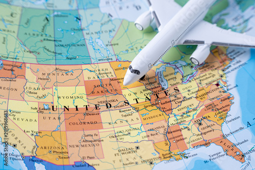 Airplane over United States map showing transatlantic travel and destination